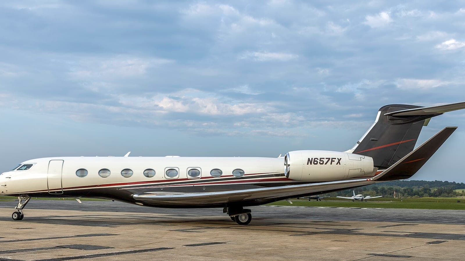 A Flexjet Gulfstream G650, N657FX, parked side-on and empty on the ramp at Frederick Municipal Airport under a heavy grey sky.