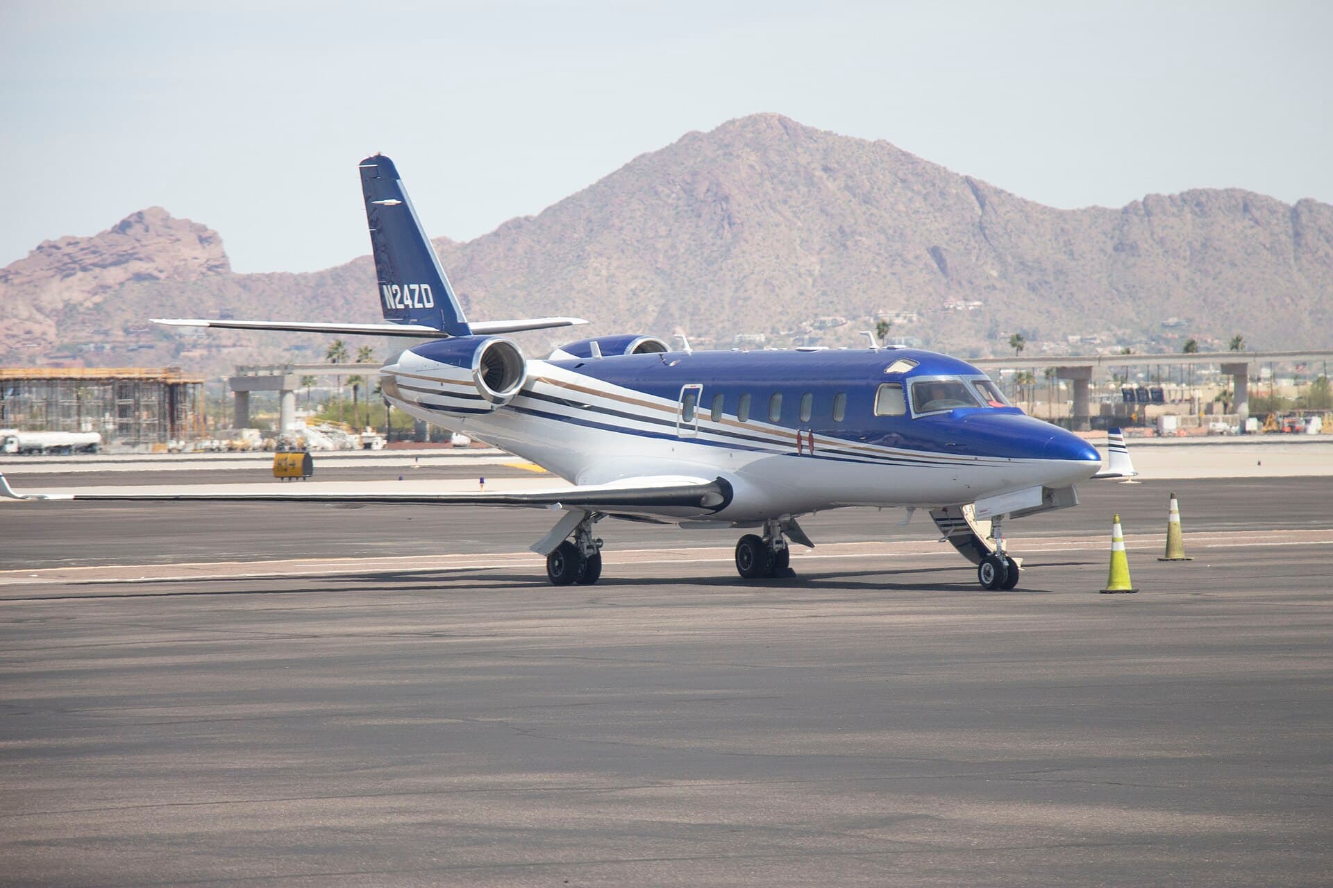 A Gulfstream G100 twin-engine business jet registered N24ZD, an airframe configured for medical transport, photographed at Phoenix Sky Harbor International Airport in daylight.