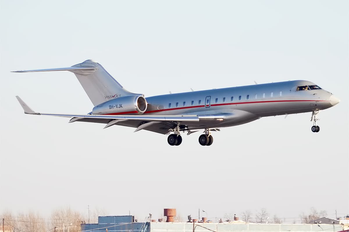 A Bombardier Global 6000 registered 9H-VJK in VistaJet Malta's silver livery with red tail, photographed at Vnukovo International Airport, Moscow.