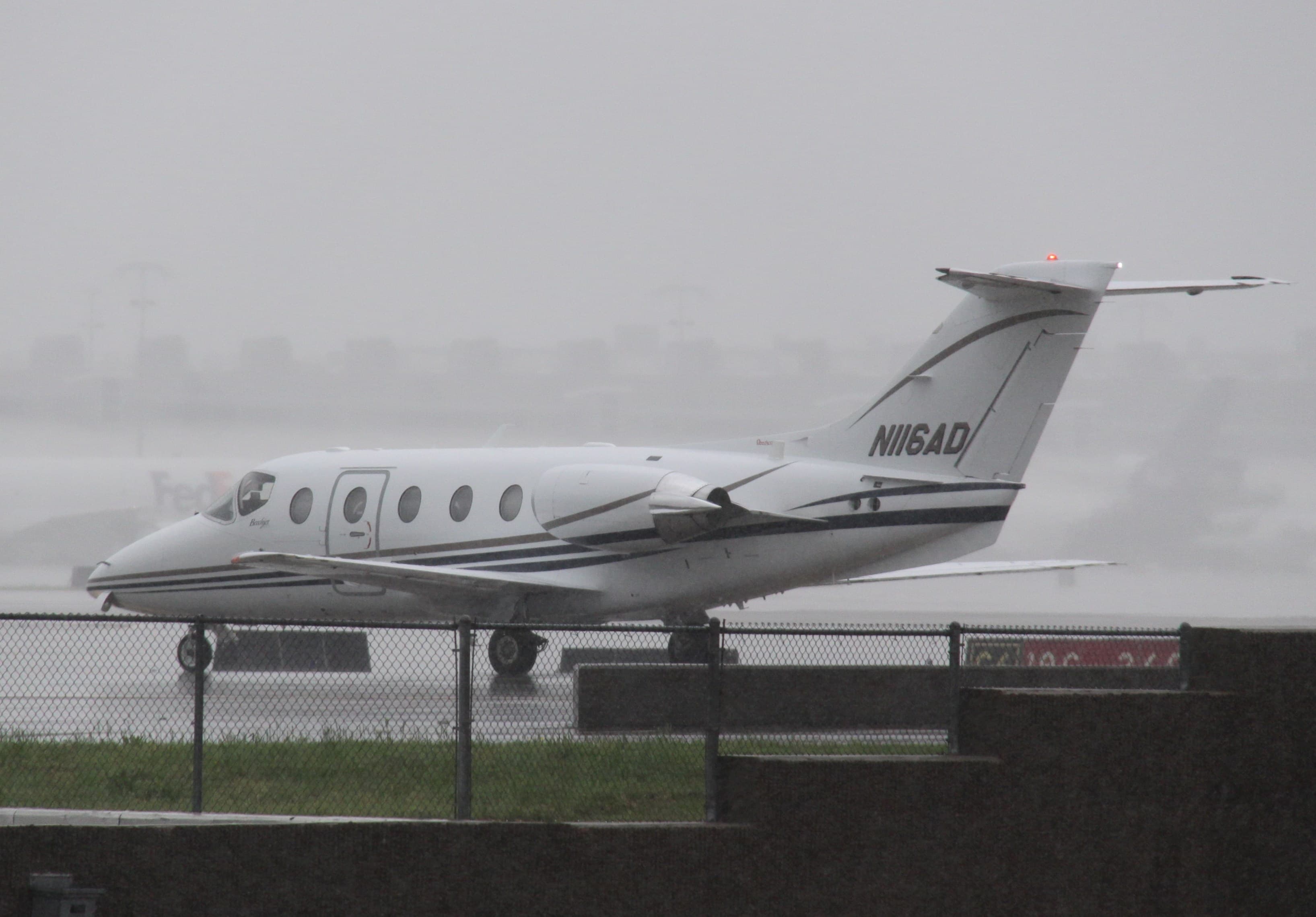 A Beechjet 400A light business jet, registration N116AD, seen side-on at Memphis International Airport.