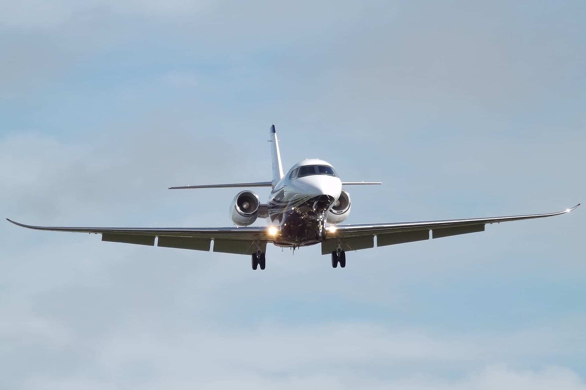 A Cessna Citation Latitude twinjet, registration N613CL, wearing Textron Aviation's company demonstrator livery, seen at Gloucestershire Airport in England.